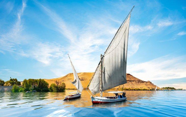 Traditional felucca sailing along the Nile River, the lifeline of Egypt&#39s civilization