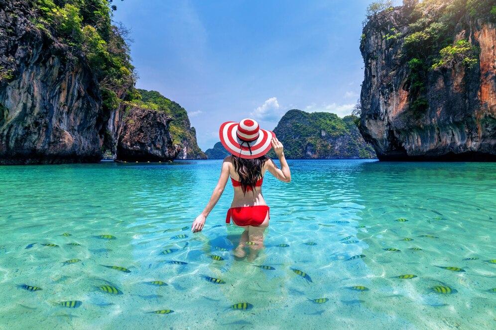beautiful-girl-surrounded-by-fish-andaman-sea-krabi-thailand
