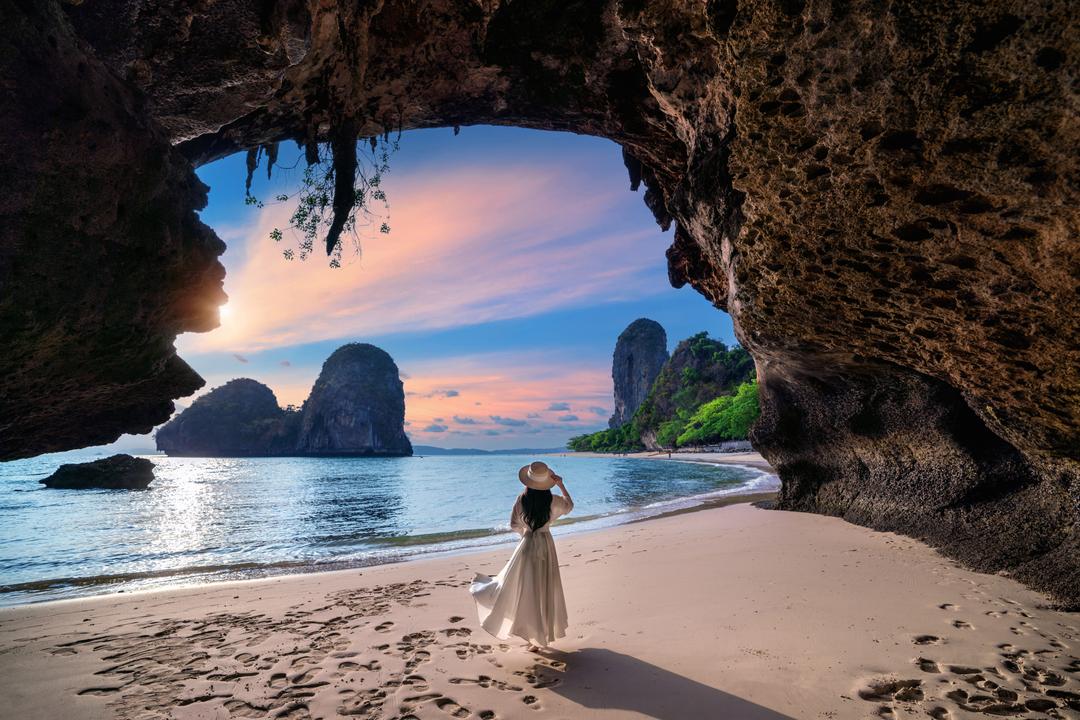 woman-walking-railay-beach-krabi-thailand